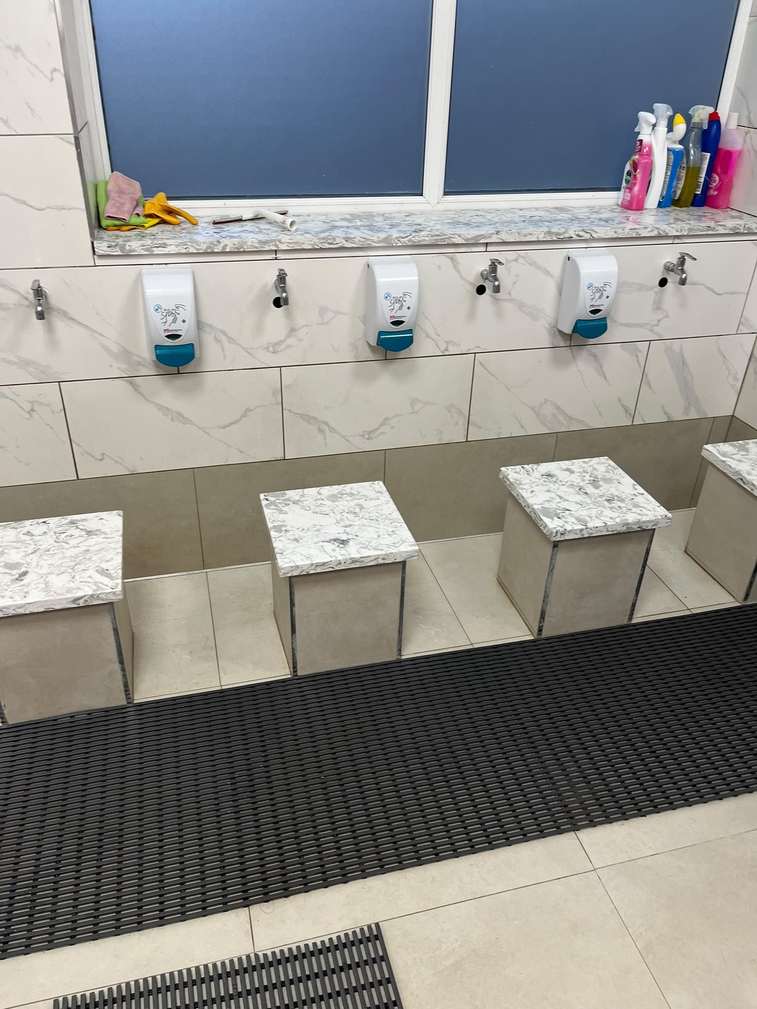Tiled ablution area with washing seats